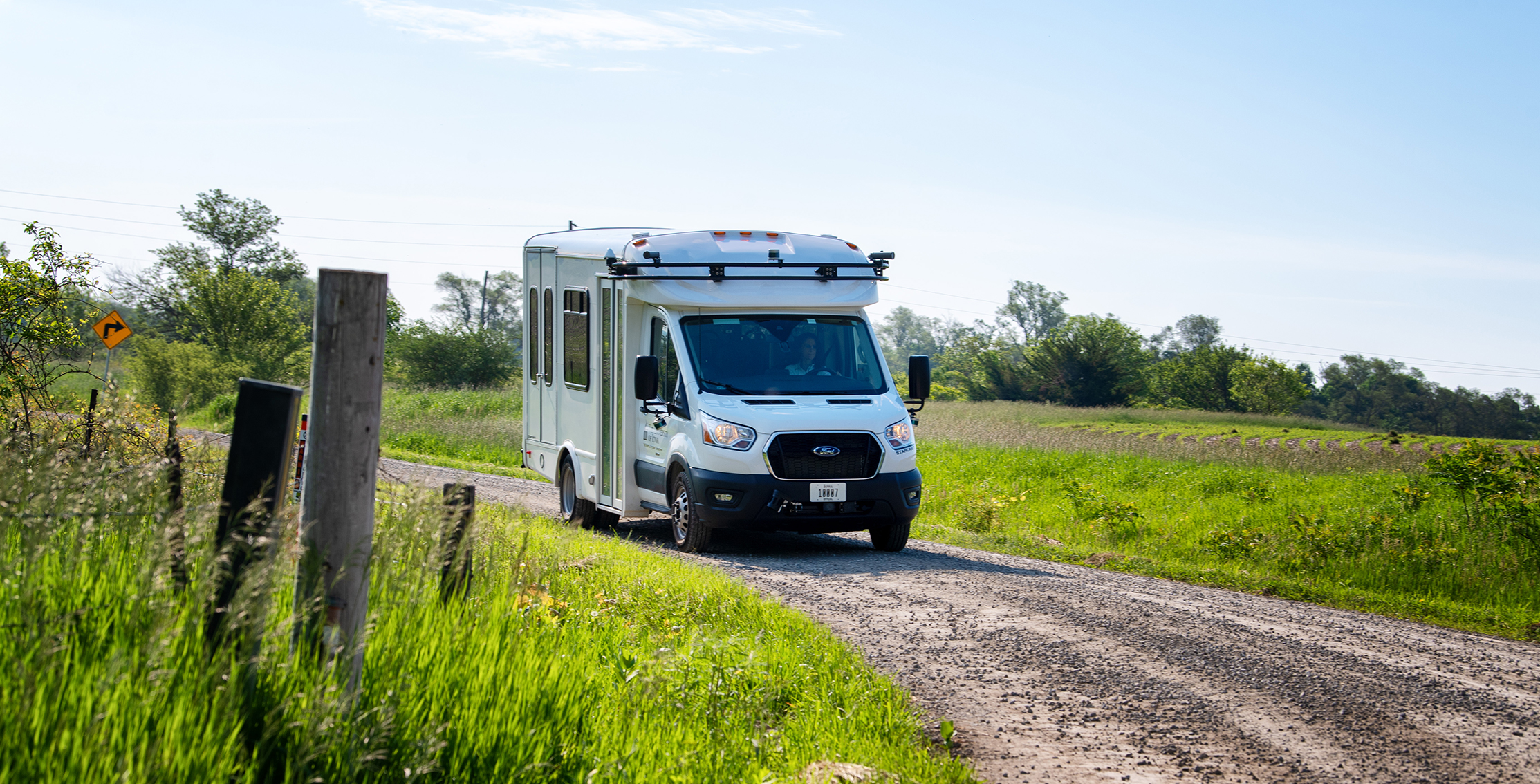 ADS Transit shuttle bus on gravel road