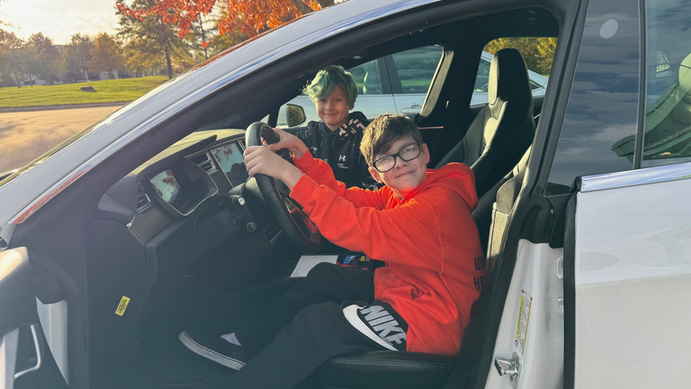Open House, two boys in Tesla